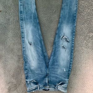 Medium wash Zara distressed skinny jeans